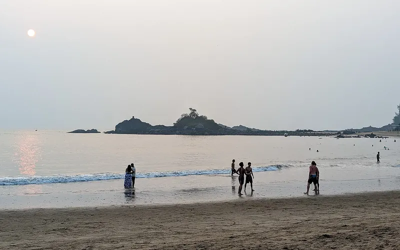 Sunset behind the rock island off the main beach at Gokarna
