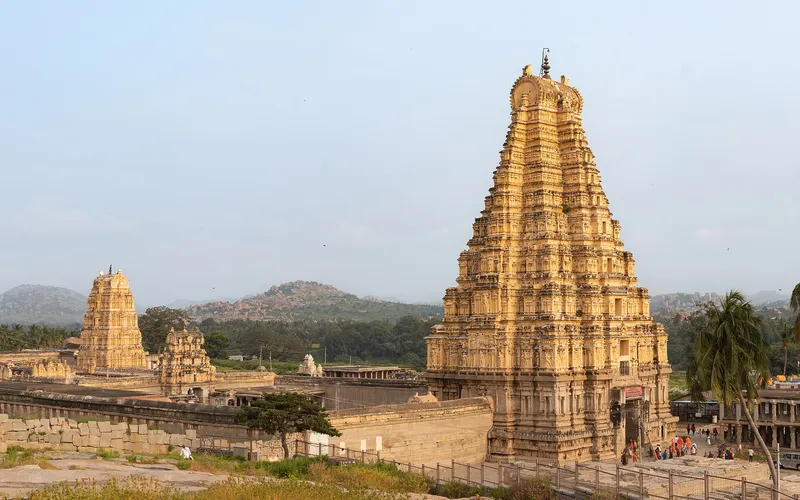 The gopura of the Virupaksha temple rising over the ruins at Hampi