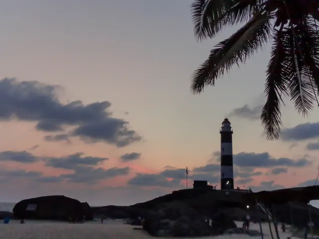 The Kapu lighthouse at dusk above the rocks