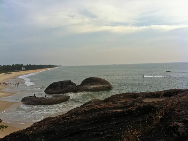 Black rocks in the surf off Kapu beach