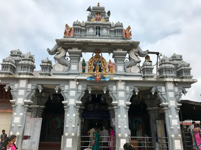The white and silver entrance of the Sri Krishna Matha
